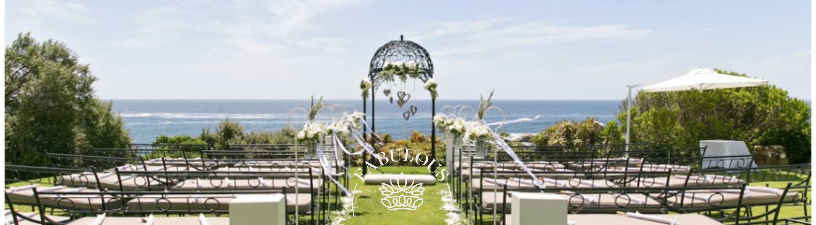 Outdoor wedding ceremony setup with ocean view, Fabulous Flowers and Gifts