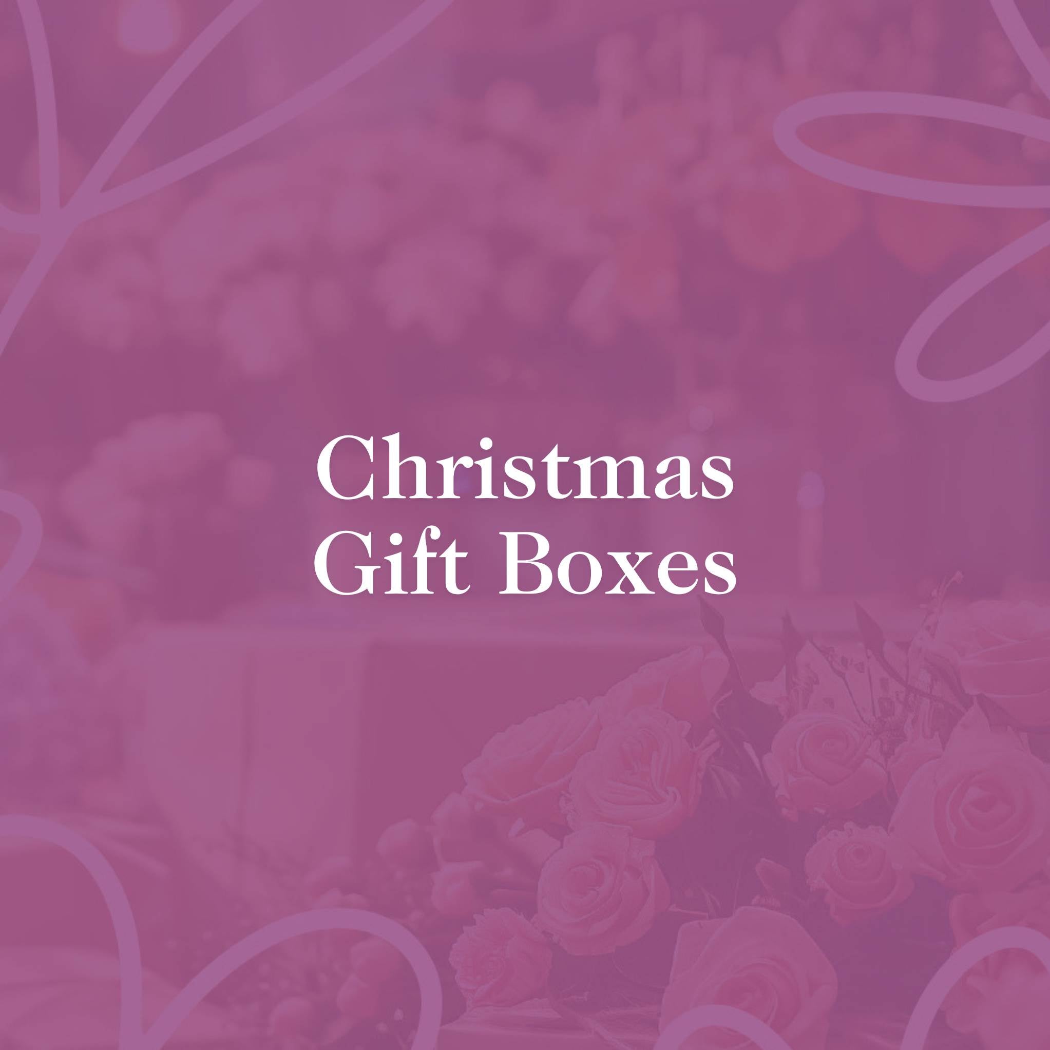 Fabulous Flowers & Gifts pink background with text promoting Christmas gift boxes.