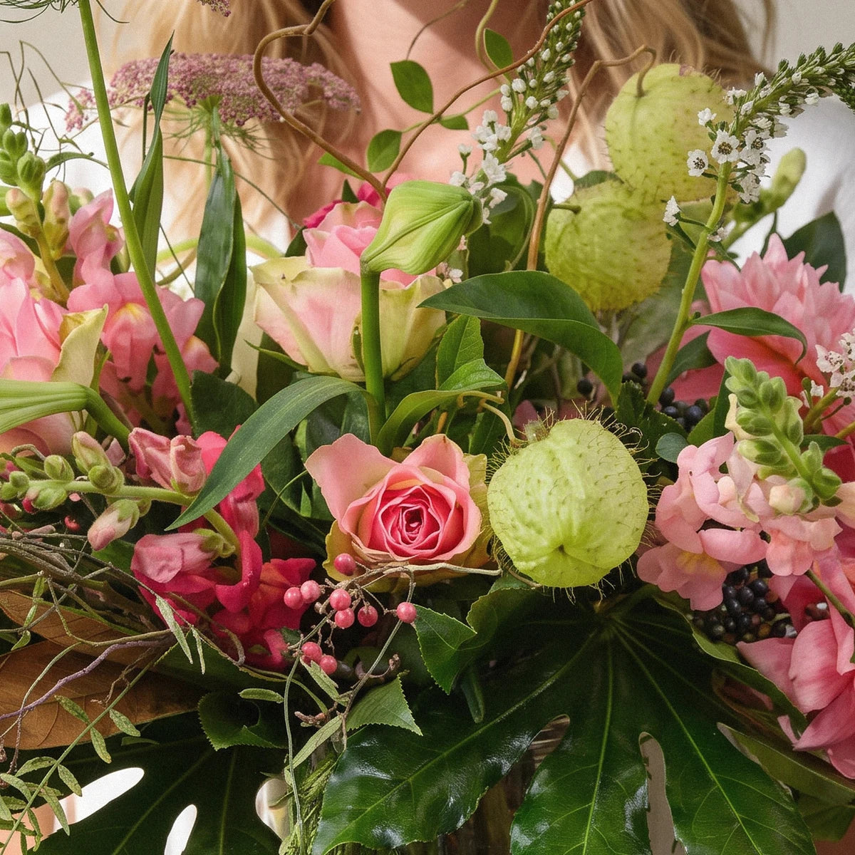Close-up of a pink rose, pink dahlia, snapdragons, lily buds and pale green cotton-bush pods, Fabulous Flowers South Africa