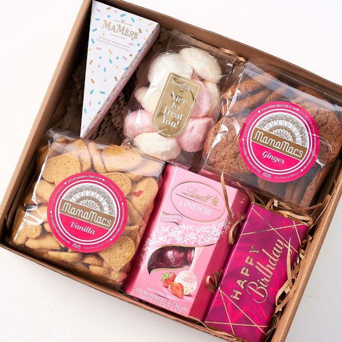Variety sweet treats box for birthday celebration, featuring vanilla and ginger cookies from Mamamac's and Lindt strawberries & cream chocolates, presented in an eco-friendly gift box.