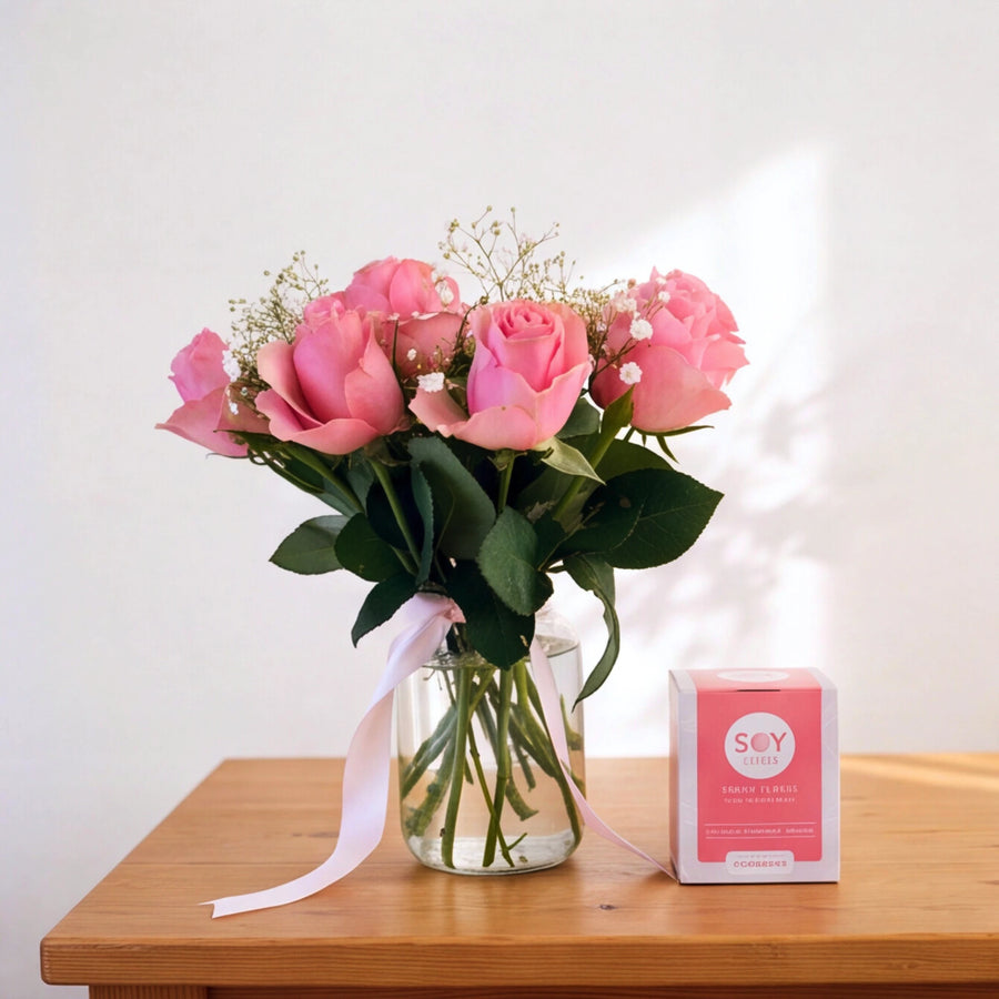 A Rosy Glow pink roses and Soy Lites candle gift set in a clear glass vase