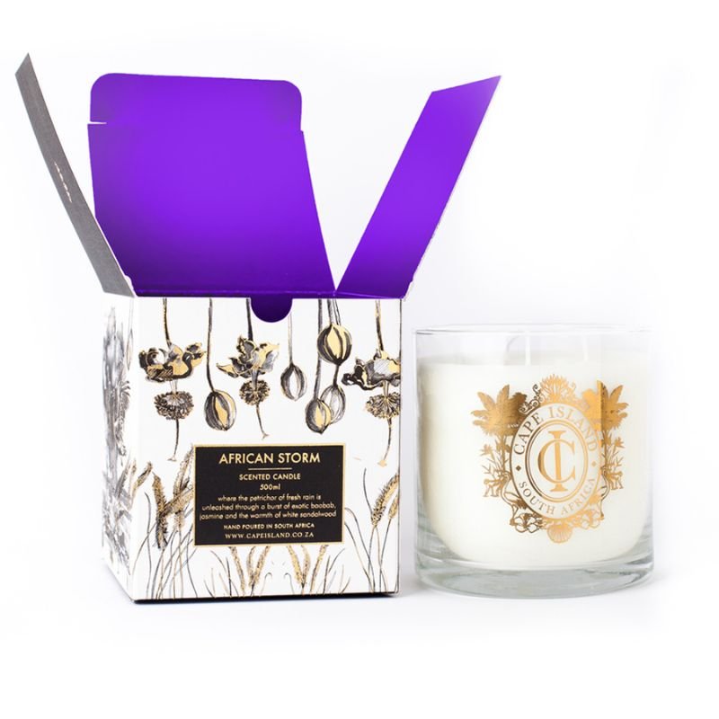 Candle with decorative packaging featuring a purple ribbon on a white background