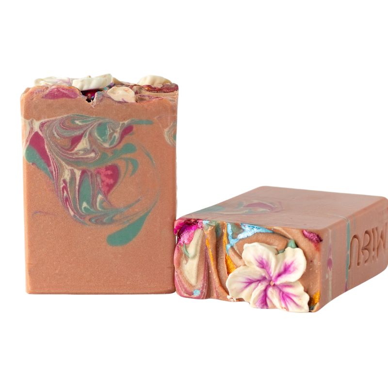 Artisan Allemande soap bar with swirls of pink, green and cream, topped with textured cream frosting and floral details