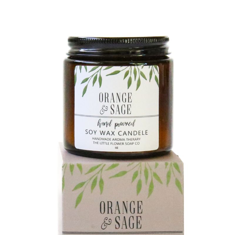 Soy wax candle with 'Orange & Sage' label on a white background