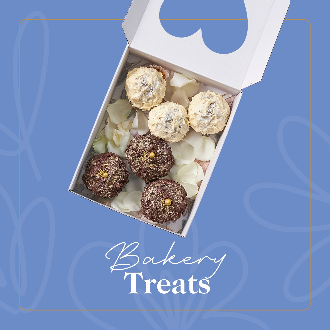 Gift box with six gourmet bakery treats on rose petals, featuring chocolate and vanilla cupcakes – Bakery Treats by Fabulous Flowers.