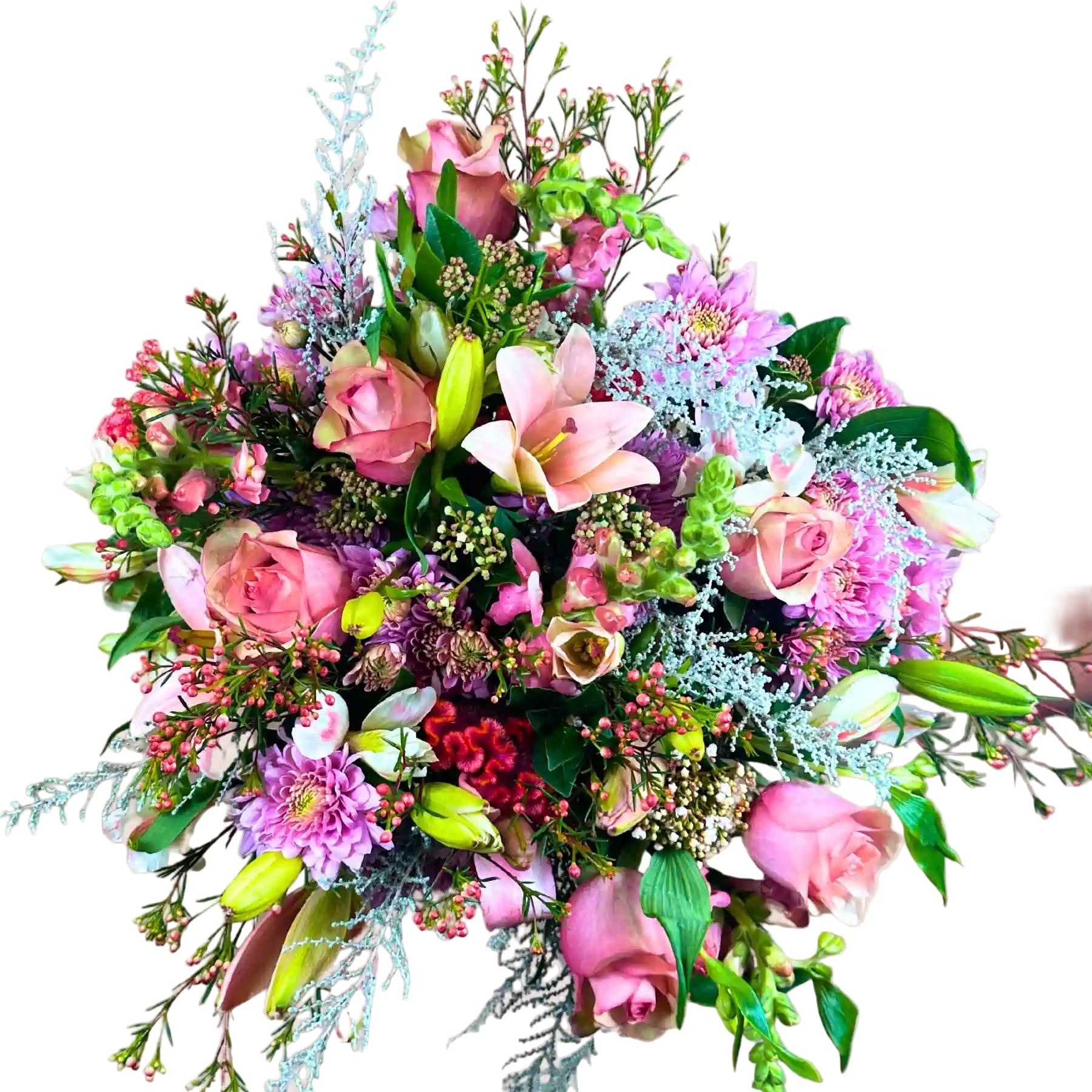 A smiling woman holding a stunning bouquet of mixed pink and white flowers, featuring roses, lilies, and assorted greenery. Bella’s Flower Bouquet. Fabulous Flowers and Gifts.