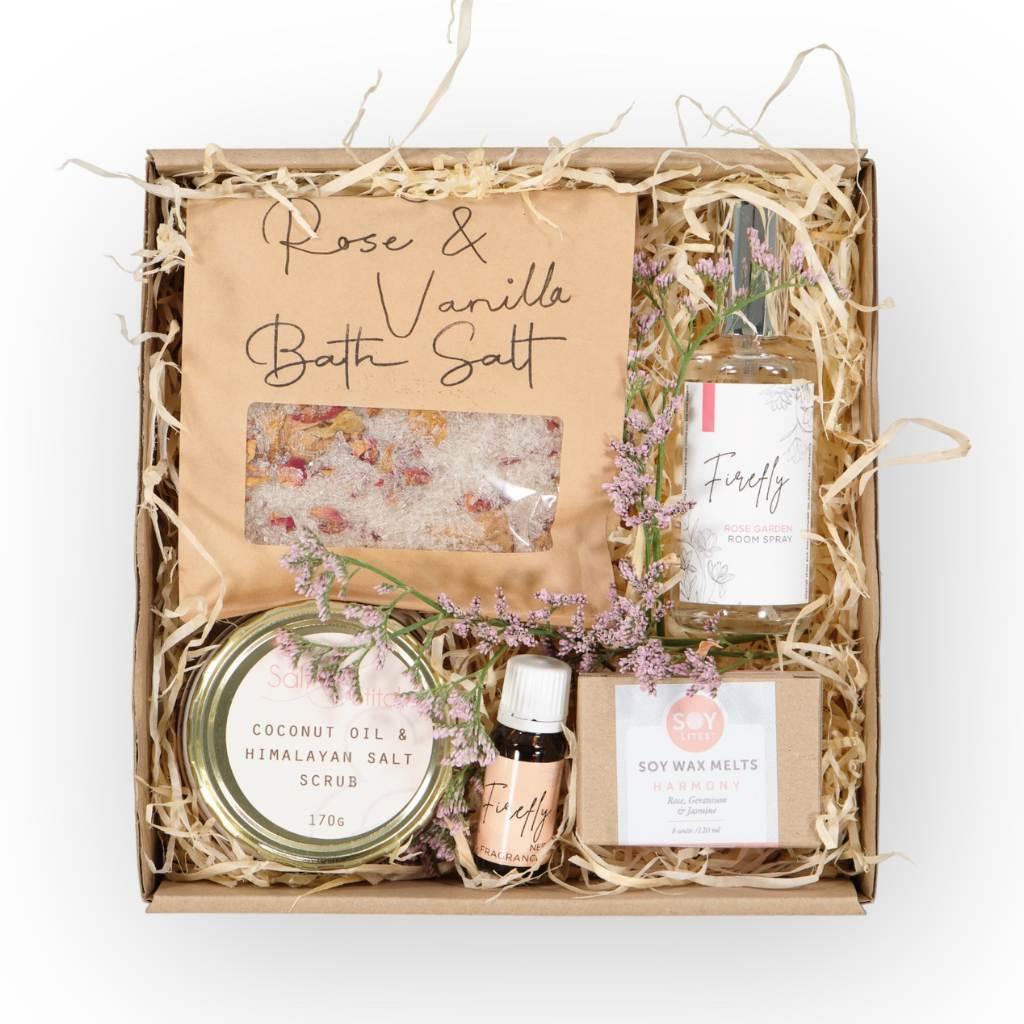 A pamper gift hamper for her filled with lovely essential oils, wax melts, room spray and bath scrub and salt - Fabulous Flowers