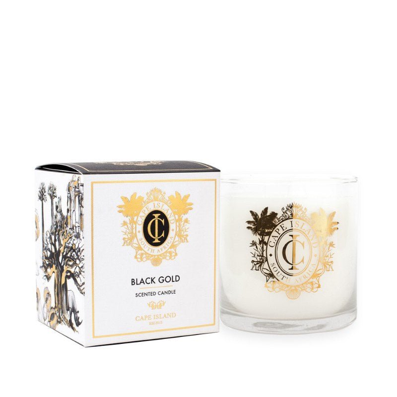 Candle and packaging with 'Black Gold' branding on a white background