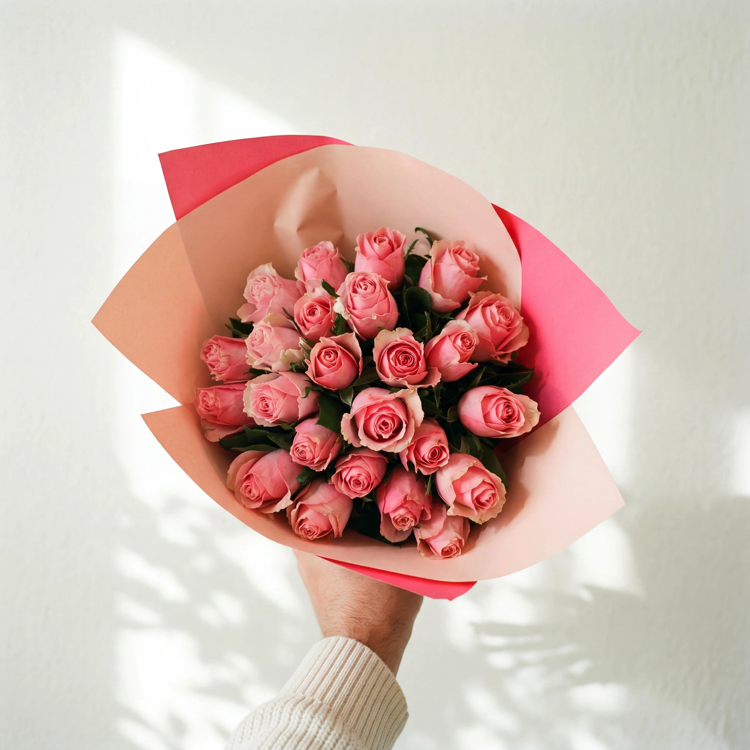 The Bonbon bouquet, two dozen pink roses in a pink and peach wrap, same-day in Cape Town and Joburg