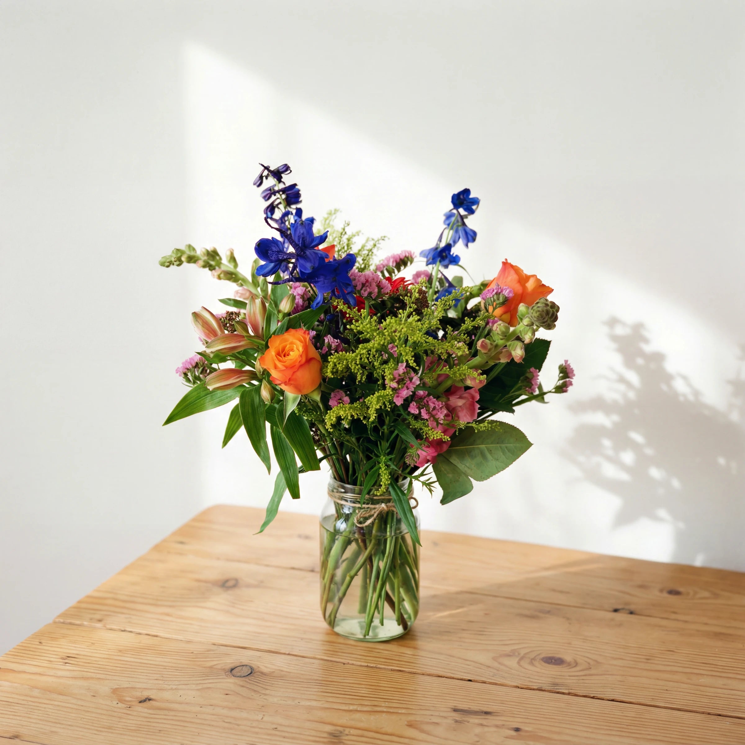 Cheer in a Jar arrangement of bright mixed flowers in a glass jar, same-day in Cape Town and Joburg