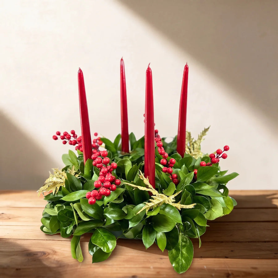 Green table wreath with four red candles, red berries and gold glitter fern on a pine table, Fabulous Flowers South Africa