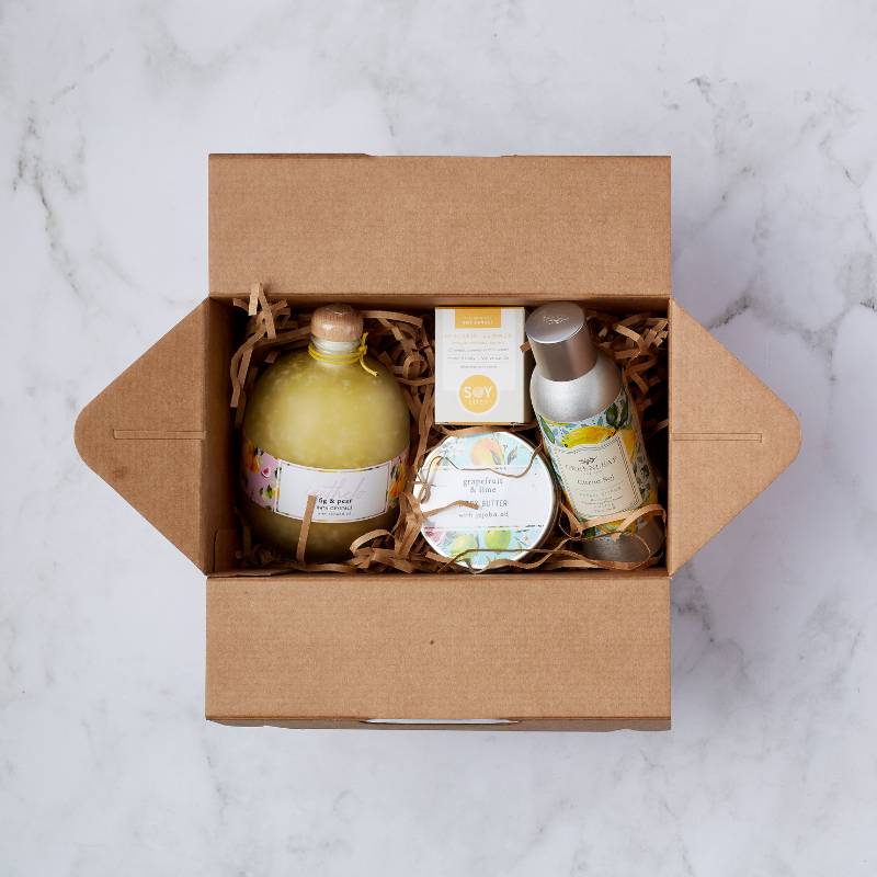 Citrus Bliss Gift Box - an elegant gift box featuring fig & pear bath crystals, grapefruit & lime body butter, citronella room spray, and a soy candle, perfect for a relaxing and rejuvenating experience.