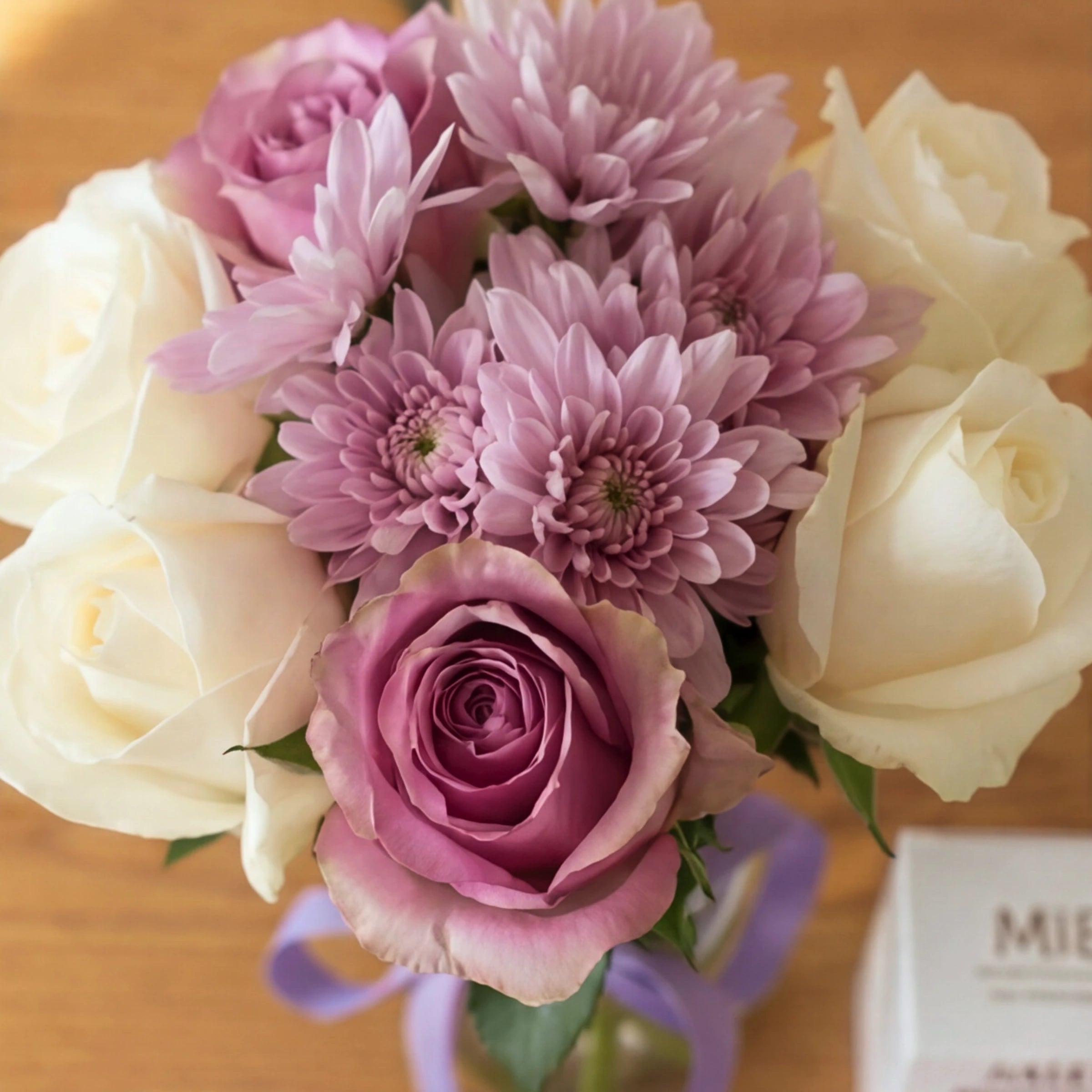 Close-up of the mauve and cream rose posy with lilac chrysanthemums in the Cleanse & Calm gift set