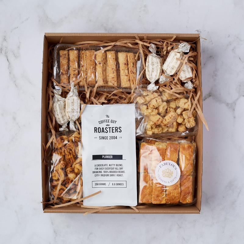 Comfort and Coffee: Savour premium coffee and tasty treats, with Sally Williams nougat and baked goods, in this indulgent gift box.