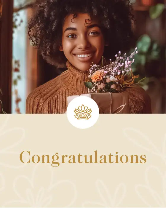 Happy woman holding a bouquet of flowers in rustic wrapping, standing indoors. Fabulous Flowers and Gifts. Congratulations Collection.