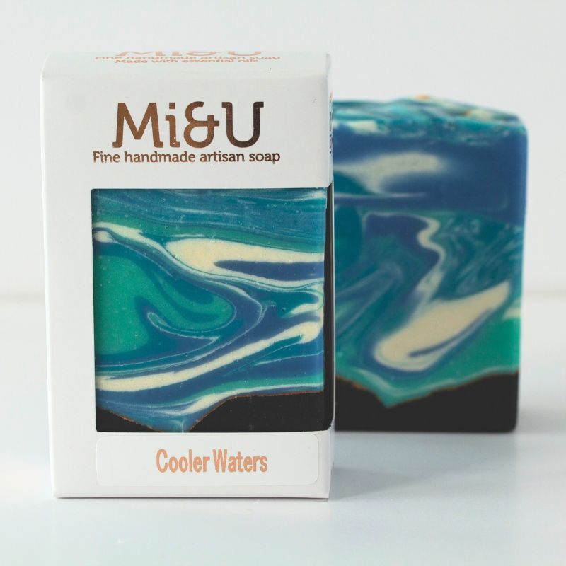 Cooler Waters handmade artisan soap in packaging with vibrant wave pattern and black base – gift-worthy and refreshing.