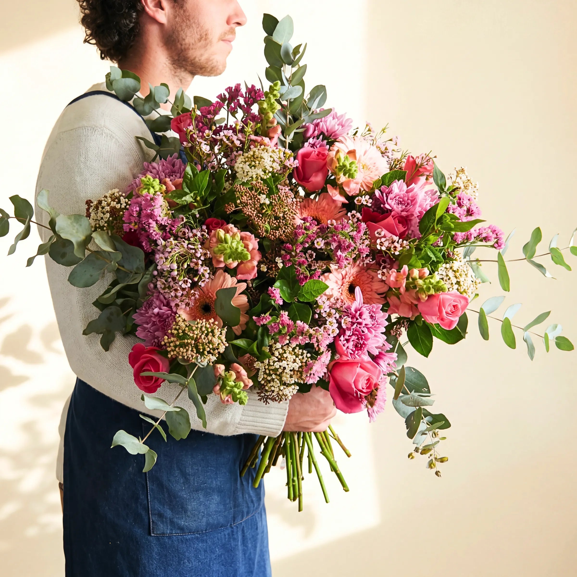 Country Garden Bouquet hand-tied by a Fabulous Flowers florist with pink roses, chrysanthemums, peach gerbera and eucalyptus