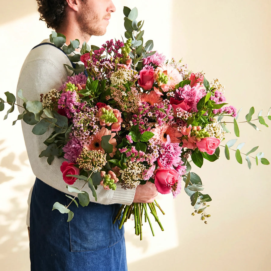 Country Garden Bouquet hand-tied by a Fabulous Flowers florist with pink roses, chrysanthemums, peach gerbera and eucalyptus