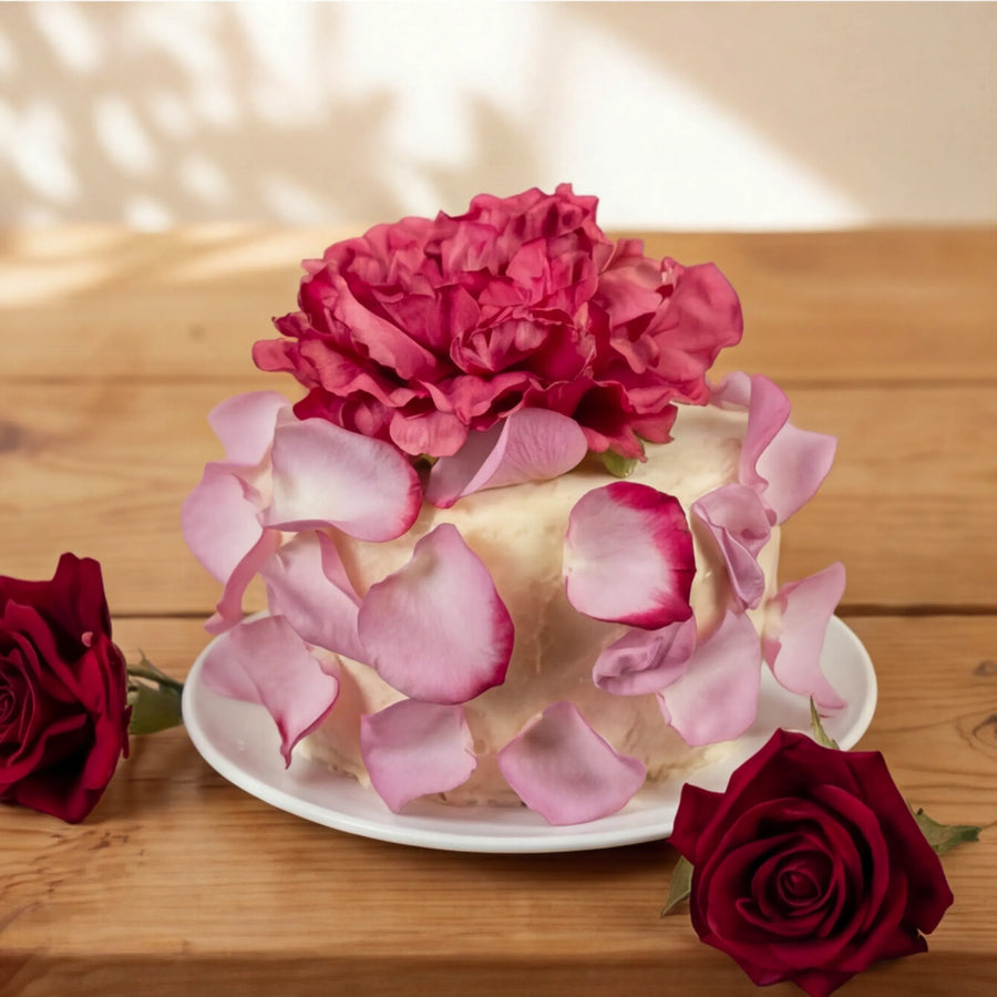 Side view of Elegance Rouge Cake with petal-clad sides and red roses, hand-made by Fabulous Flowers Cape Town