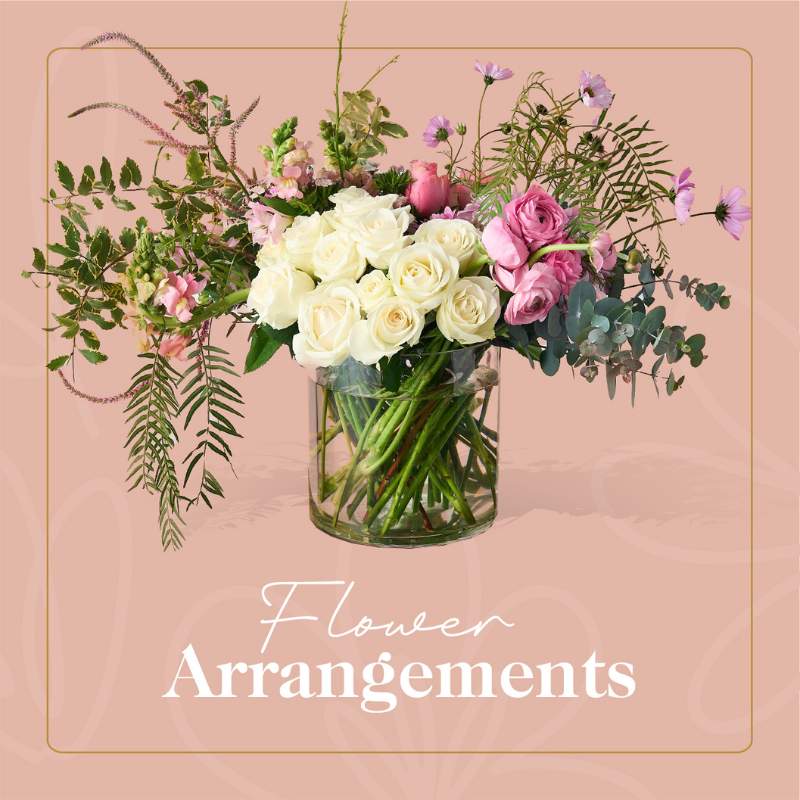 Fabulous Flowers & Gifts - Elegant flower arrangement with pink and white roses in a glass vase, ideal for any occasion.