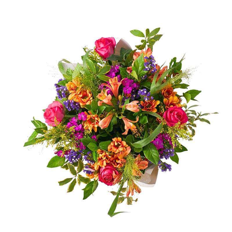 Top view of Grateful For You arrangement with pink roses, bright mixed blooms and fresh foliage