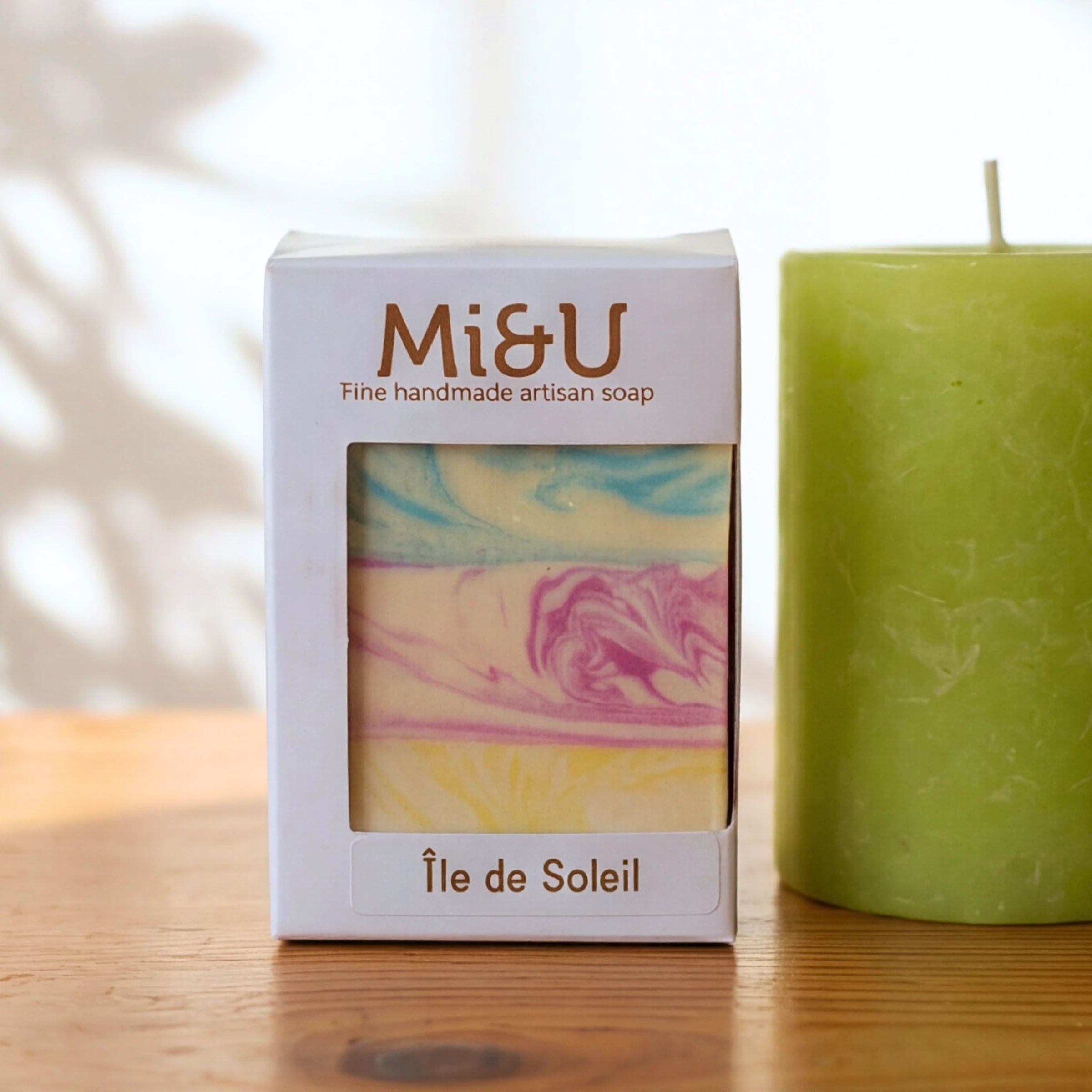 Mi&U Île de Soleil artisan soap and a lime-green pillar candle from the Lather & Light candle gift set