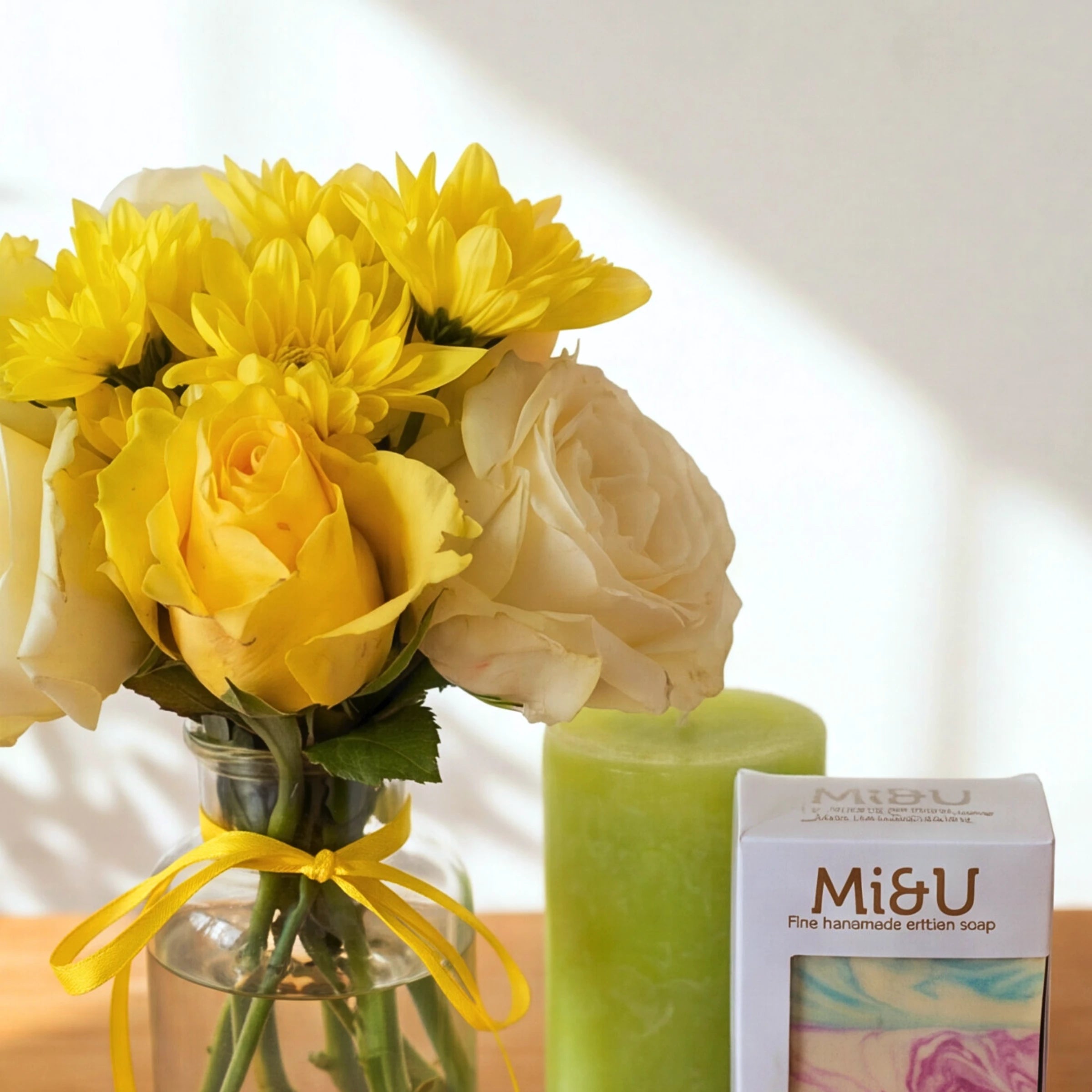 Lather & Light candle gift set with a sunny rose posy, green pillar candle and Mi&U Île de Soleil soap
