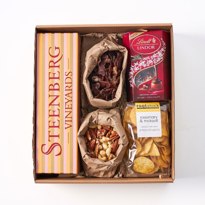 Let’s Celebrate Gift Hamper with Steenberg wine, biltong, nuts, Lindt chocolate and rosemary rock salt chips.
