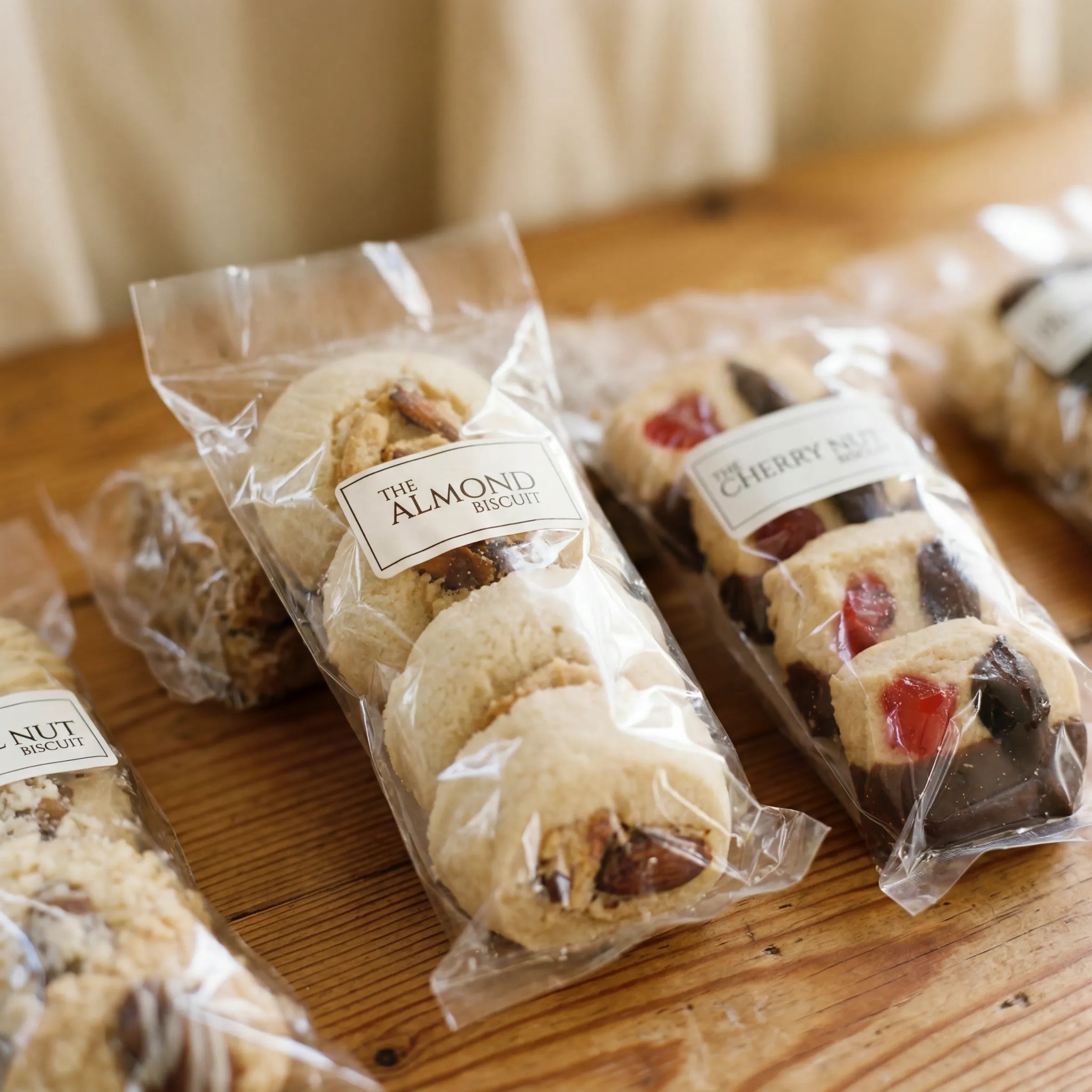 Close-up of Almond Biscuit and Cherry Nut Biscuit sleeves from the Luxury Biscuits Small box by Fabulous Flowers