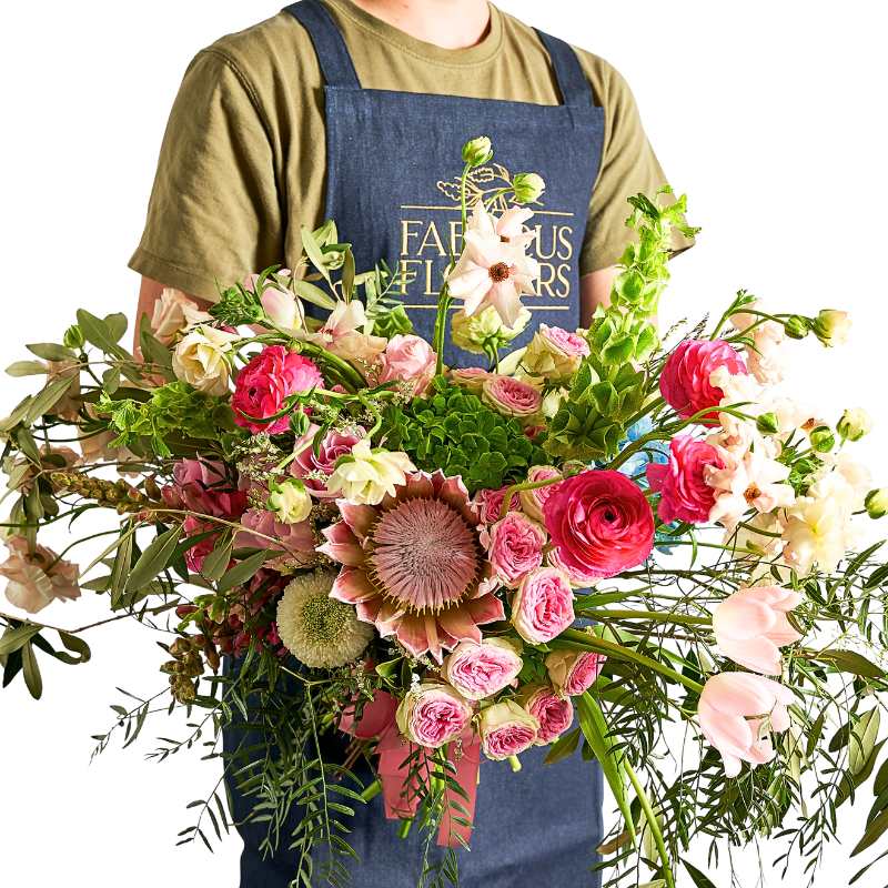 Luxury florist choice bouquet arrangement with mixed exotic flowers in a decorative vase