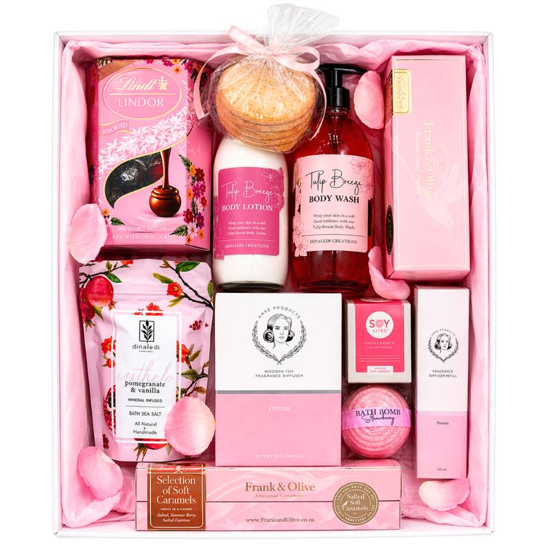 Gift set with various skincare and bath products in a pink box