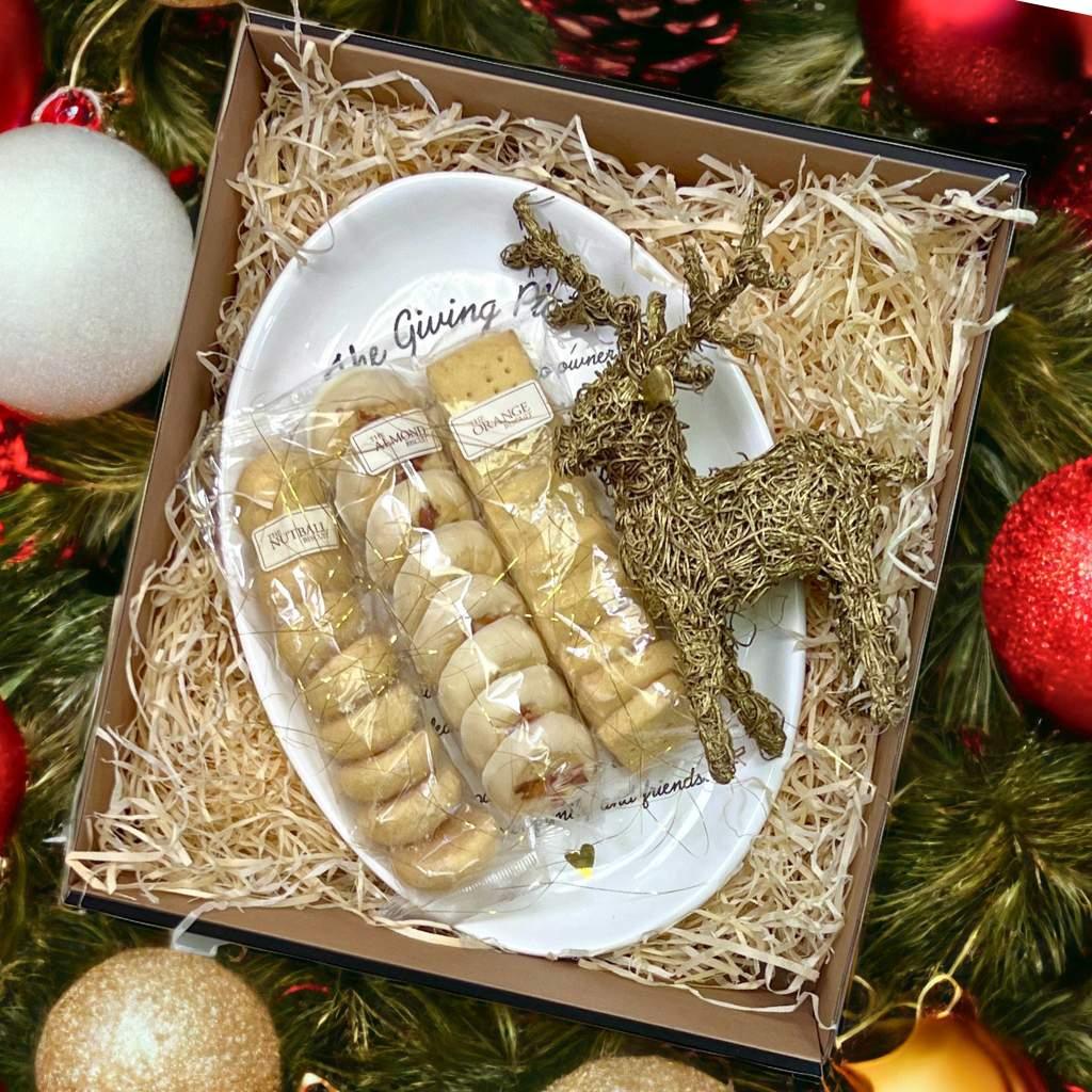 Merry Giving Platter adorned with festive accents surrounded by Christmas baubles - Fabulous Flowers