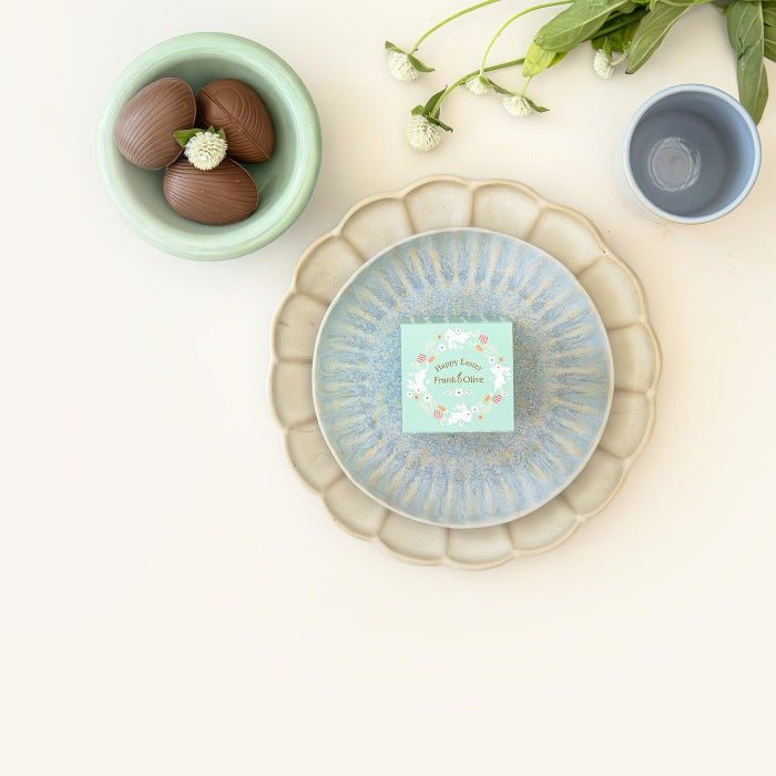 Mini Easter Box - Fabulous Flowers & Gifts styled with ceramic plates and chocolate eggs in a pastel mint green bunny-themed box.