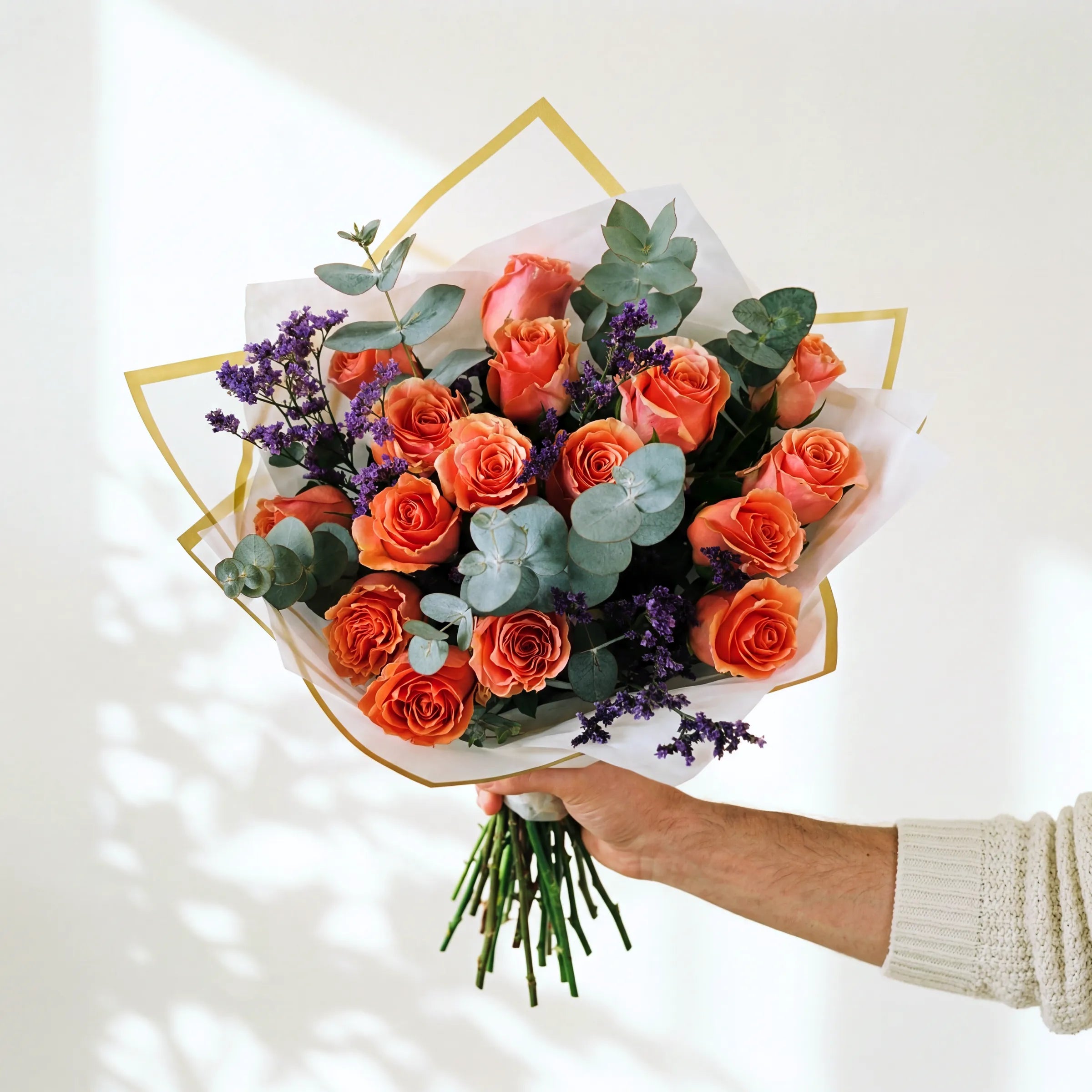Medium Orange Royale bouquet of coral-orange roses with eucalyptus and purple limonium, same-day Cape Town and Joburg
