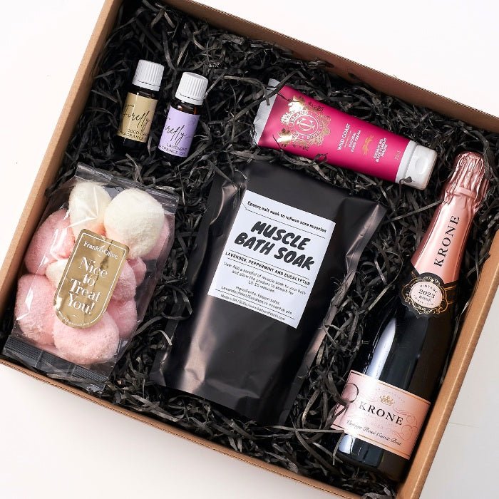 Pamper and Indulge Gift Box - Fabulous Flowers & Gifts top-down view of luxury pamper set with champagne and spa bath goodies.