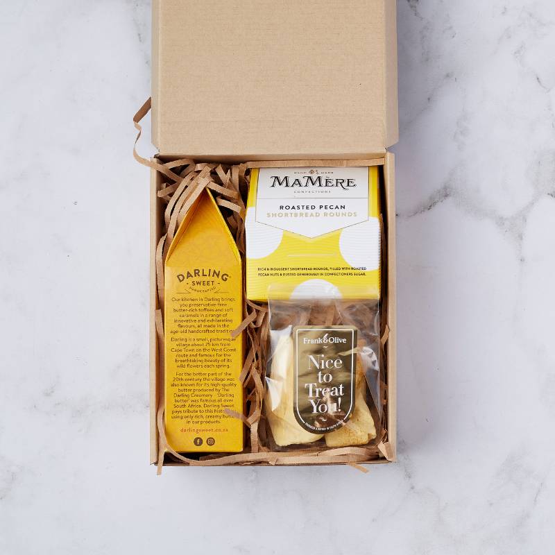 Top-down view of Pecan Shortbread & Treats Box featuring Darling Sweet toffees, roasted pecan shortbread rounds, and Frank & Olive treats, elegantly packed in eco-friendly packaging.