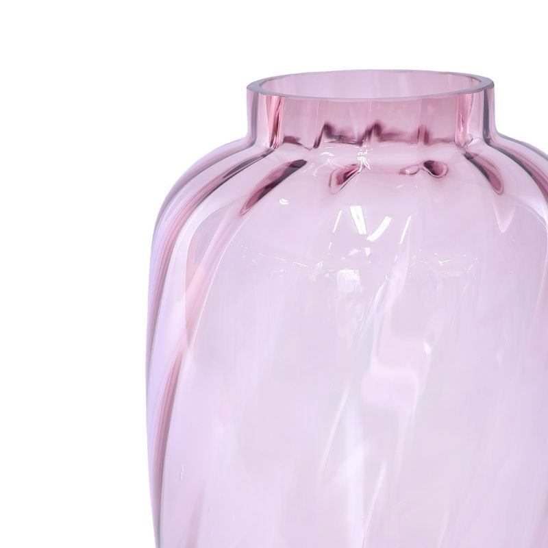 Pink glass vase on a white background