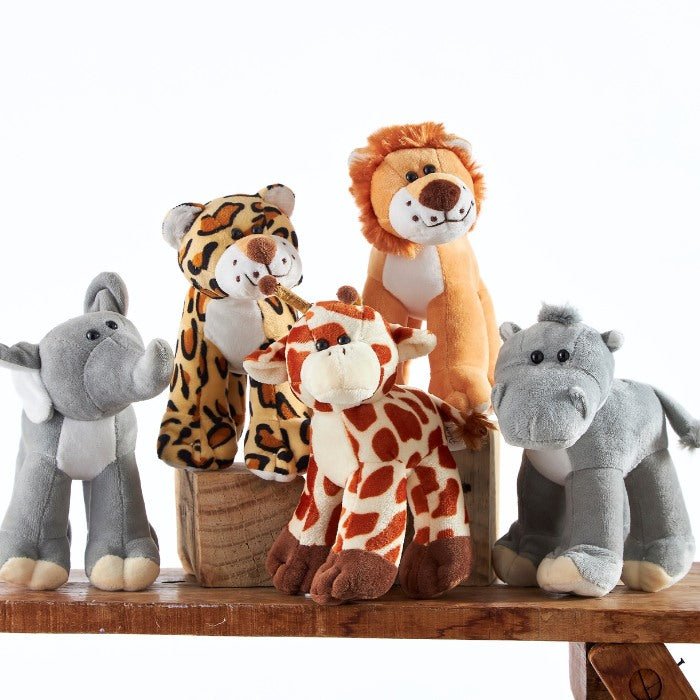 Close-up view of Safari Softies, a set of soft stuffed animals including a lion, elephant, and giraffe, ideal for children's educational toys and safari-themed nurseries.