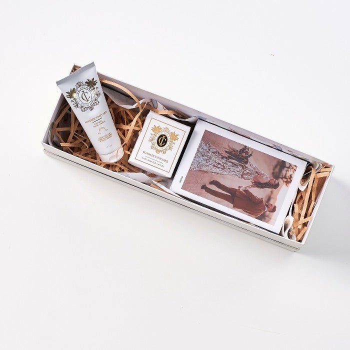 Elegant Scent of a Woman Gift Box including Summer Vineyard hand cream, soap, and romantic couple print in white packaging.