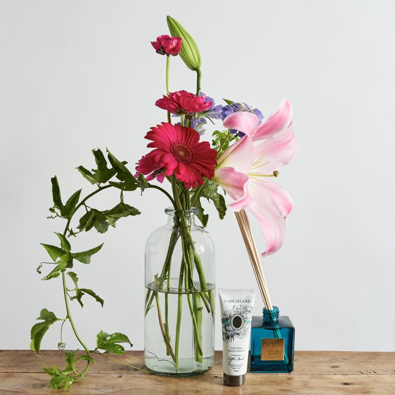 Scents of Summer includes a fresh flower vase arrangement with gerberas, lilies and scabiosa flowers, a diffuser and hand cream. Order fro same day flower delivery to the people you love in Cape Town today. Fabulous Flowers and Gifts. 