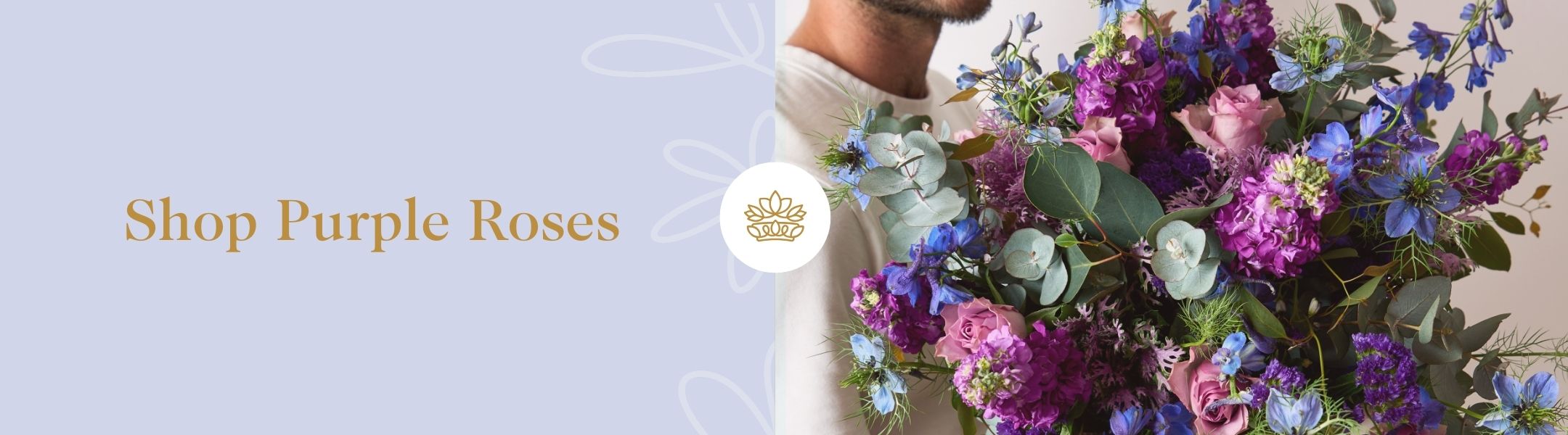 Shop Purple Roses - Fabulous Flowers and Gifts featuring a man in white shirt holding a lush bouquet of purple and pink blooms.