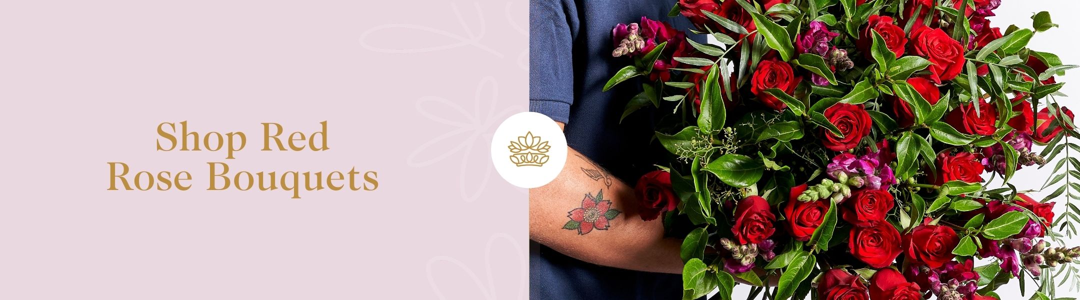 Shop Red Rose Bouquets featuring lush red roses with greenery and purple accents, held by a tattooed florist – Fabulous Flowers & Gifts