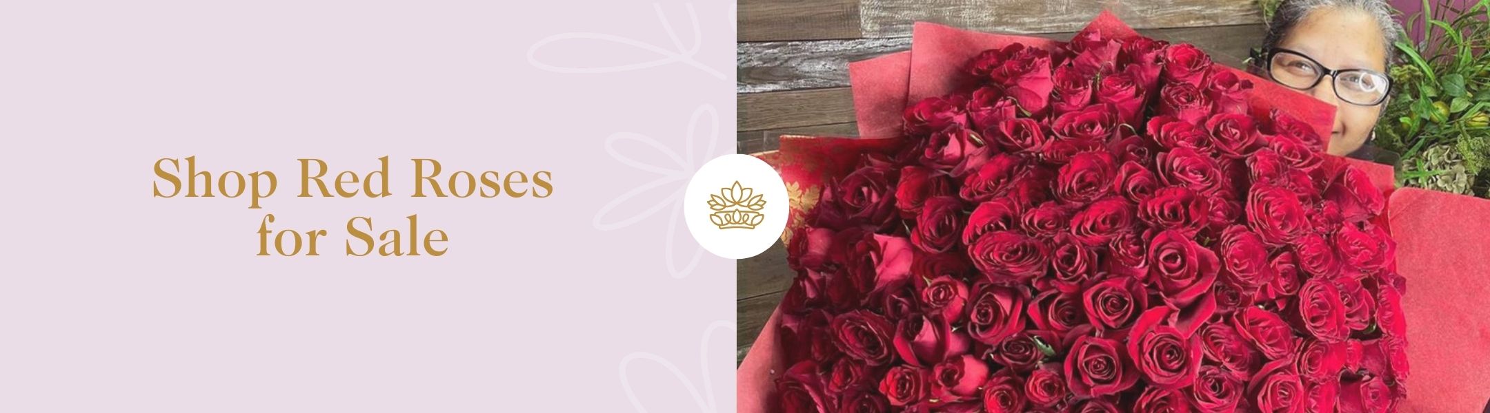 Shop Red Roses for Sale - Fabulous Flowers and Gifts showcasing a large red rose bouquet held by a smiling florist in glasses.