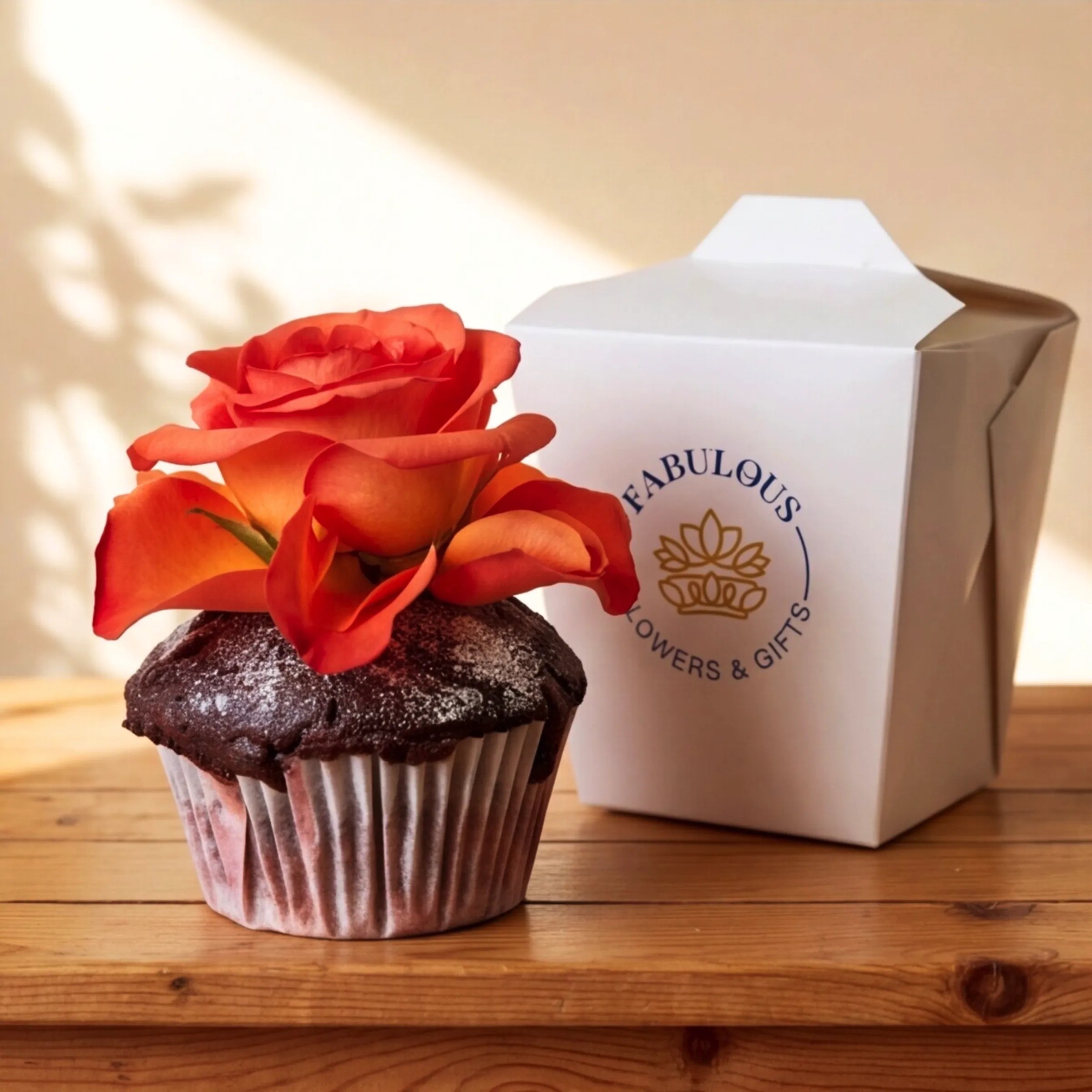 Single chocolate cupcake with orange rose topper paired with its individual Fabulous Flowers branded box, Cape Town same-day add-on for flowers and gift hampers
