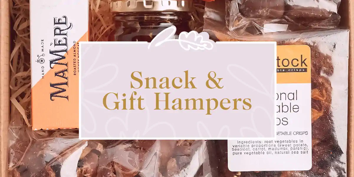A variety of delicious snacks and gourmet items in a neatly arranged hamper. Fabulous Flowers and Gifts - Snack & Gift Hampers