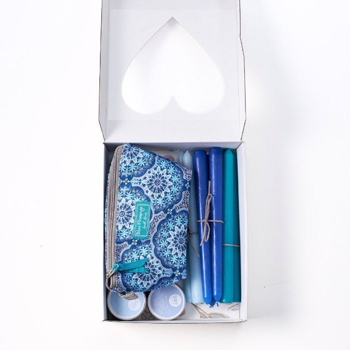 Soft Light & Gentle Things - Fabulous Flowers & Gifts blue-themed gift box with candles, skincare tins, and patterned pouch.