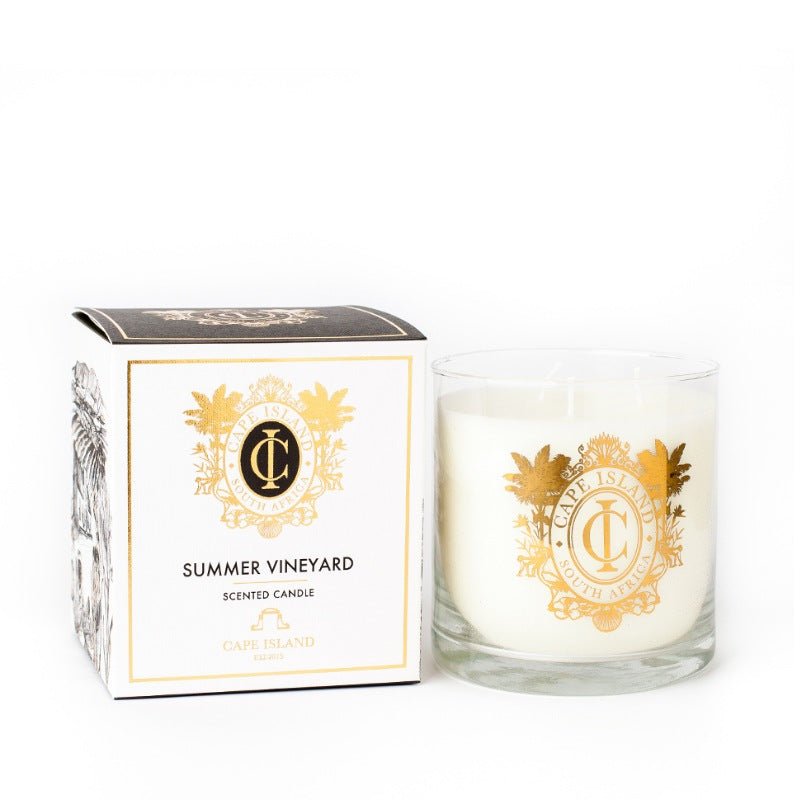 Candle and packaging with gold emblem on a white background