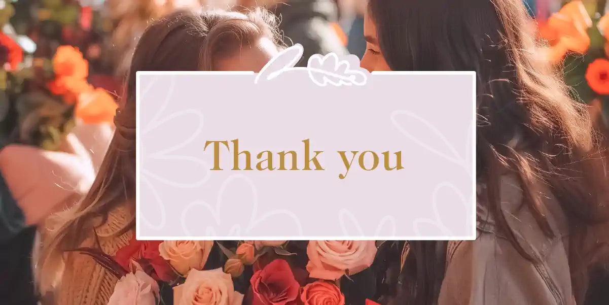 Two people sharing a heartfelt moment with a bouquet of pink and orange roses, expressing gratitude. Thank You Collection. Fabulous Flowers and Gifts.