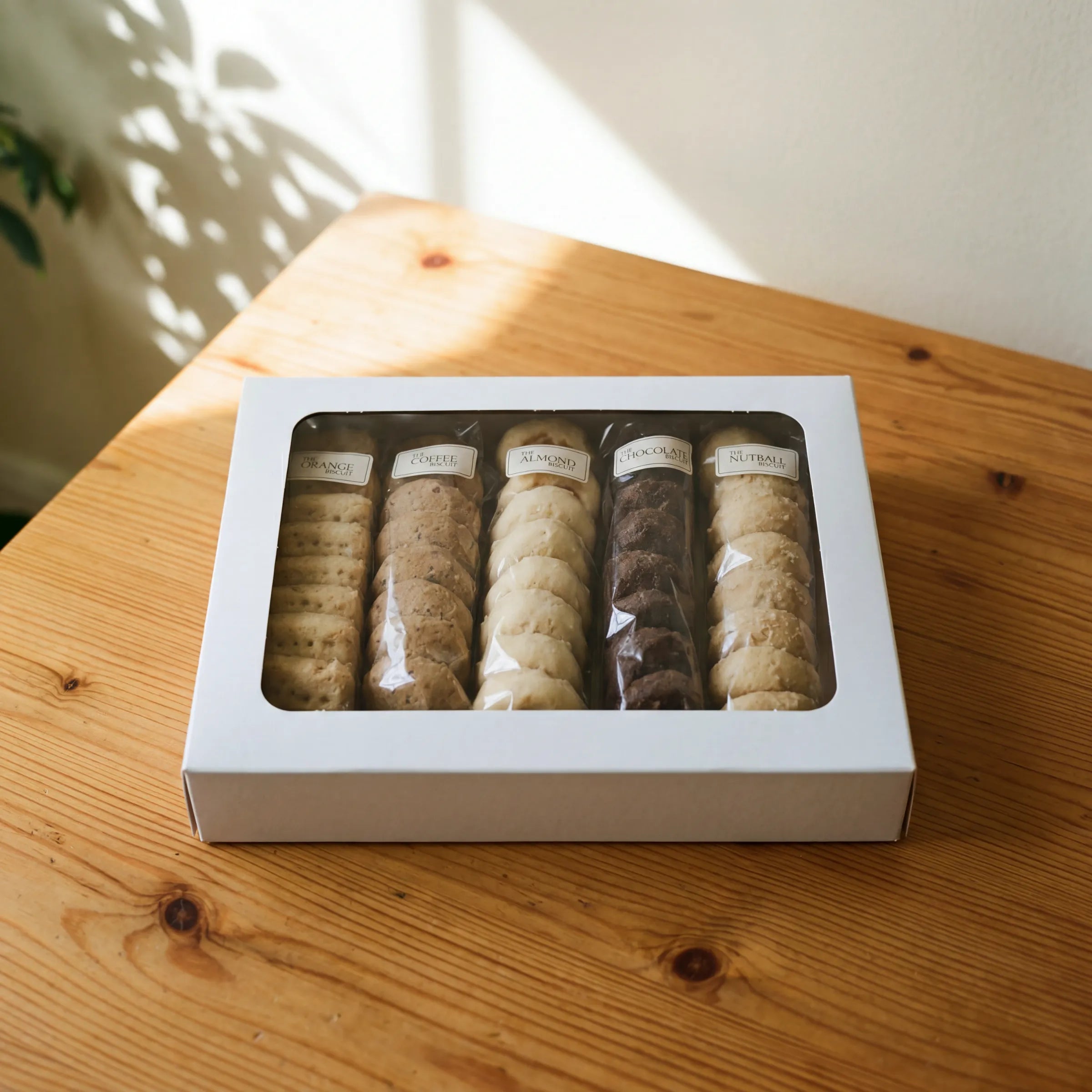 The Best Biscuits white gift box with viewing window showing all five biscuit flavours, ready for nationwide delivery