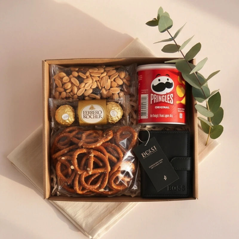 The Boss's Box flat-lay with Bossi leather wallet, Pringles Original, Ferrero Rocher, salted peanuts and salted pretzels, Fabulous Flowers and Gifts